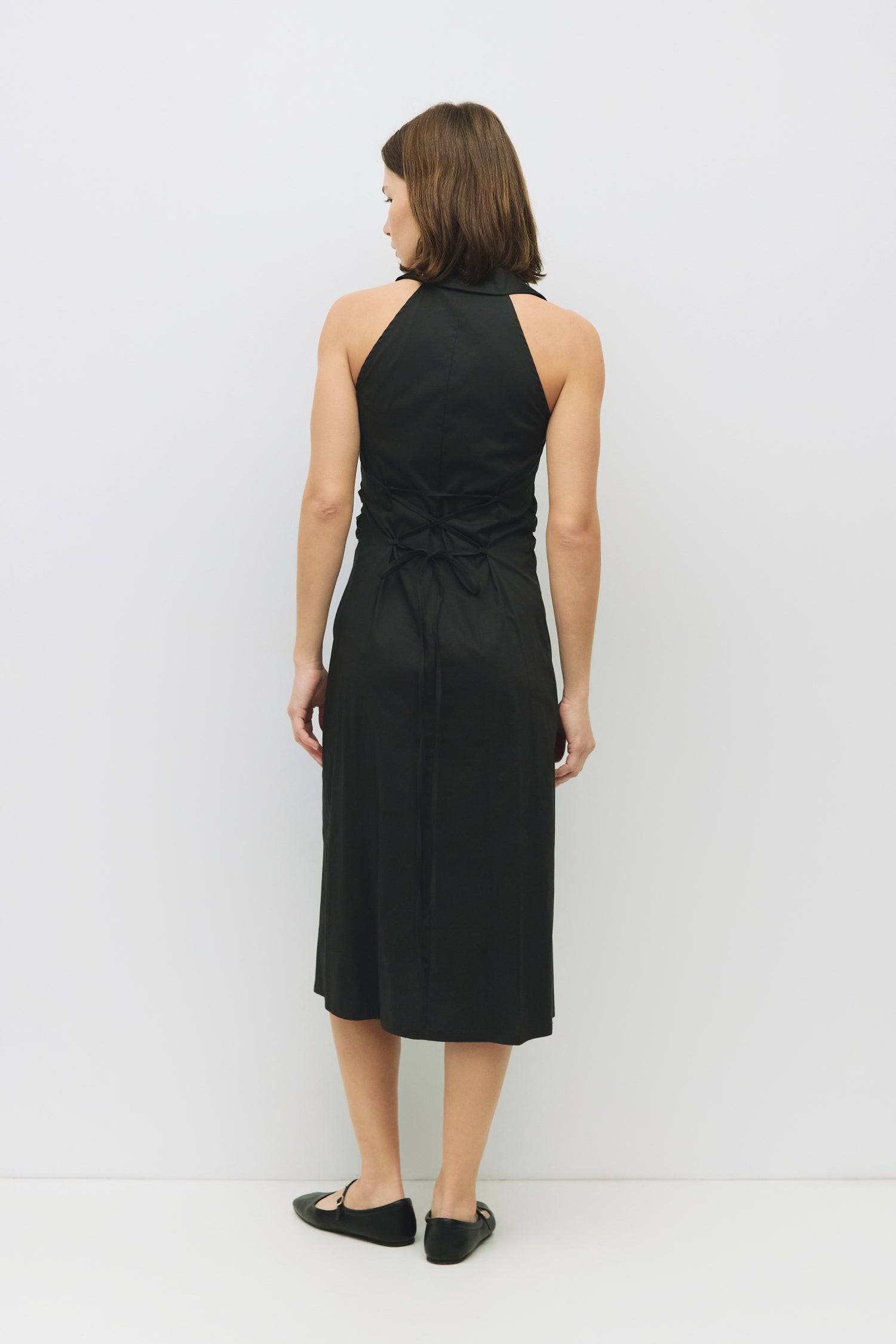 8983745003741, The Cambria Dress, Dress, Mod Ref, Black,Casual,cf-color-black,cf-color-red,cf-color-white,cf-size-l,cf-vendor-all-row,collared,Comfort,Comfortable,Feminine,full skirt,Midi,Midi Dress,midi length,new,Red,Sleeveless,Sleeveless Dress,Spring,versatile,white,Womens, Information The Cambria Dress is a sleeveless, midi-length poplin dress featuring a halter neckline with a collar and a front button placket. With adjustable lace-back ties, it offers a customizable fit and effortless style for warm-w