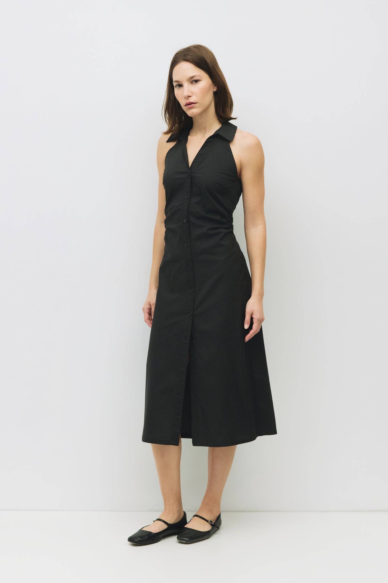 8983745003741, The Cambria Dress, Dress, Mod Ref, Black,Casual,cf-color-black,cf-color-red,cf-color-white,cf-size-l,cf-vendor-all-row,collared,Comfort,Comfortable,Feminine,full skirt,Midi,Midi Dress,midi length,new,Red,Sleeveless,Sleeveless Dress,Spring,versatile,white,Womens, Information The Cambria Dress is a sleeveless, midi-length poplin dress featuring a halter neckline with a collar and a front button placket. With adjustable lace-back ties, it offers a customizable fit and effortless style for warm-w