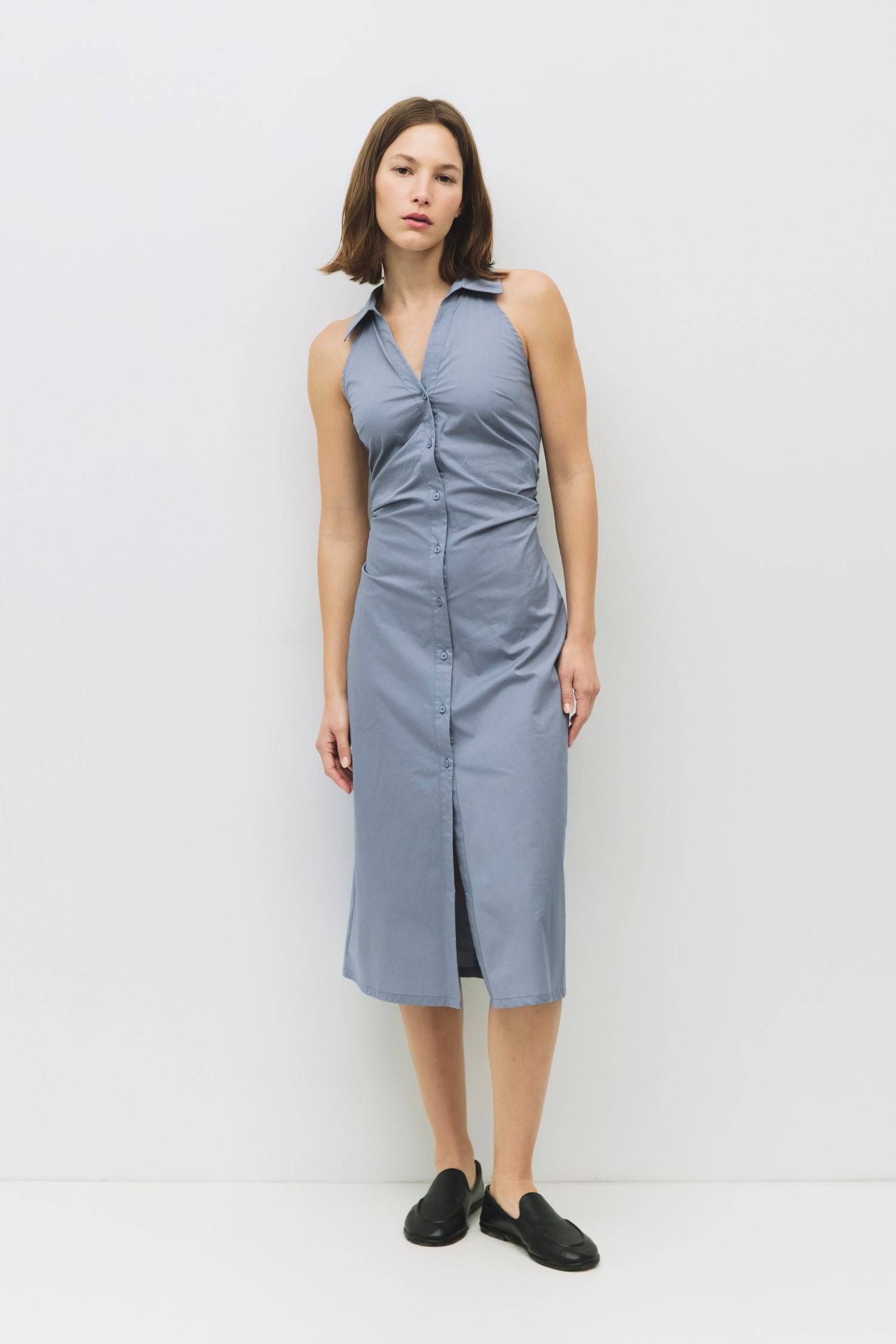 8983745003741, The Cambria Dress, Dress, Mod Ref, Black,Casual,cf-color-black,cf-color-red,cf-color-white,cf-size-l,cf-vendor-all-row,collared,Comfort,Comfortable,Feminine,full skirt,Midi,Midi Dress,midi length,new,Red,Sleeveless,Sleeveless Dress,Spring,versatile,white,Womens, Information The Cambria Dress is a sleeveless, midi-length poplin dress featuring a halter neckline with a collar and a front button placket. With adjustable lace-back ties, it offers a customizable fit and effortless style for warm-w