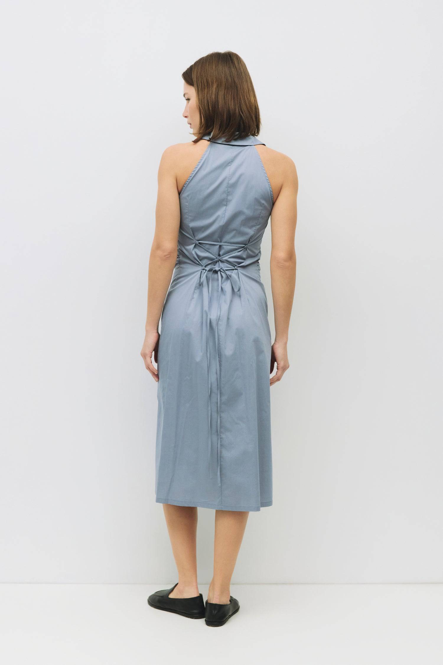 8983745003741, The Cambria Dress, Dress, Mod Ref, Black,Casual,cf-color-black,cf-color-red,cf-color-white,cf-size-l,cf-vendor-all-row,collared,Comfort,Comfortable,Feminine,full skirt,Midi,Midi Dress,midi length,new,Red,Sleeveless,Sleeveless Dress,Spring,versatile,white,Womens, Information The Cambria Dress is a sleeveless, midi-length poplin dress featuring a halter neckline with a collar and a front button placket. With adjustable lace-back ties, it offers a customizable fit and effortless style for warm-w