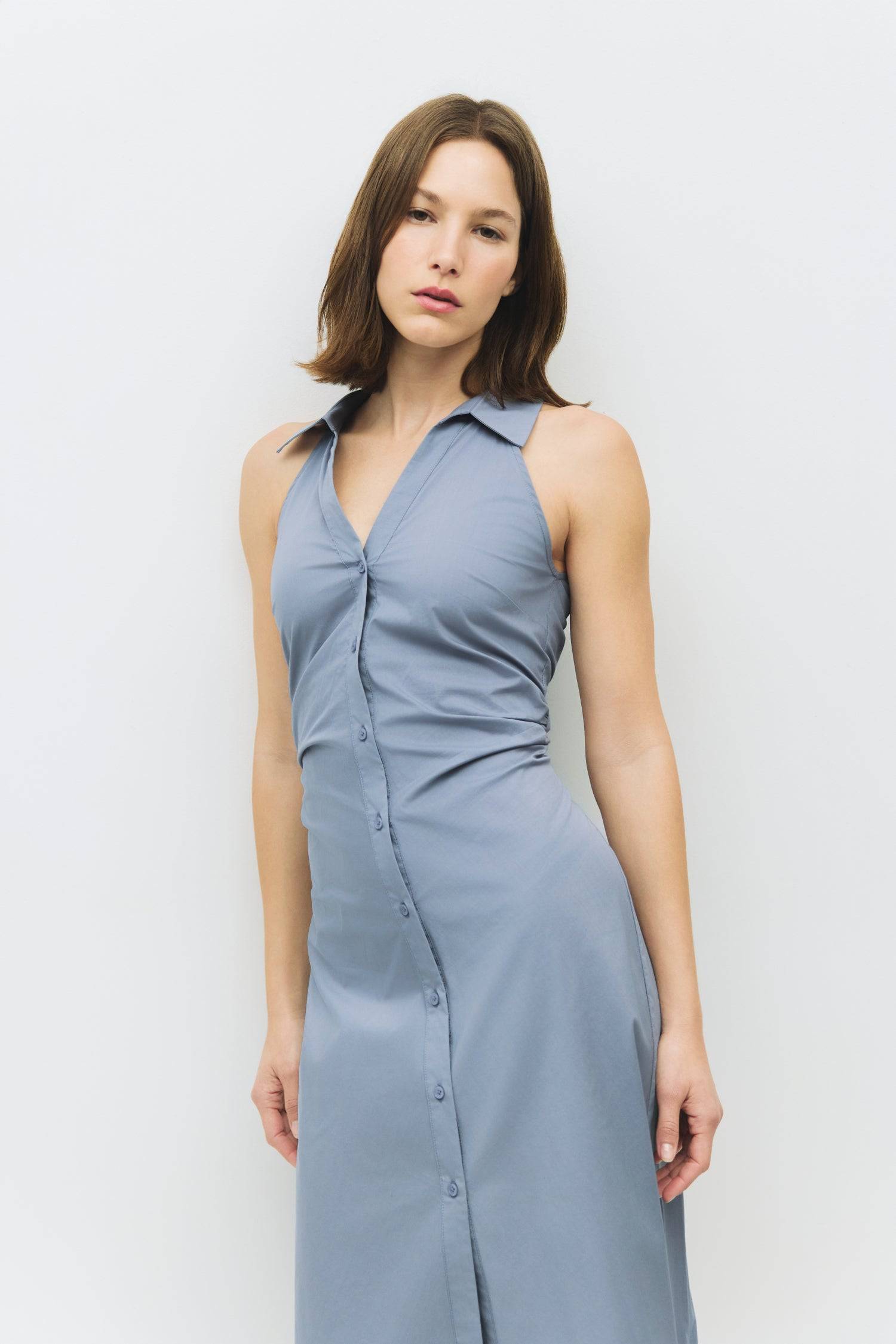 8983745003741, The Cambria Dress, Dress, Mod Ref, Black,Casual,cf-color-black,cf-color-red,cf-color-white,cf-size-l,cf-vendor-all-row,collared,Comfort,Comfortable,Feminine,full skirt,Midi,Midi Dress,midi length,new,Red,Sleeveless,Sleeveless Dress,Spring,versatile,white,Womens, Information The Cambria Dress is a sleeveless, midi-length poplin dress featuring a halter neckline with a collar and a front button placket. With adjustable lace-back ties, it offers a customizable fit and effortless style for warm-w