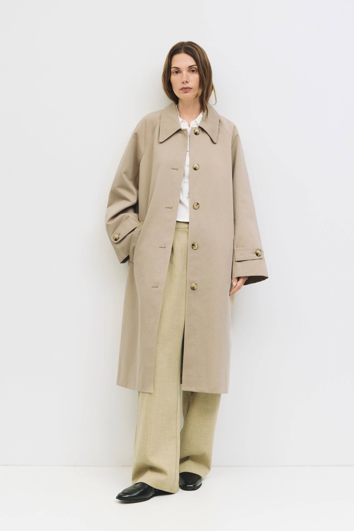 9045717582045, The Serena Coat, Outerwear, Mod Ref, beige,cf-color-beige,cf-color-olive,cf-size-l,cf-size-m,cf-size-s,cf-vendor-mod-ref,Coat,coat jacket,Comfort,Comfortable,Detail,Details,Fall,layer,layering,Layers,Long,Long Sleeve,midi length,modref,new,Olive,Outerwear,Oversized,Oversized Coat,Peacoat,Pockets,scarf,Spring,Summer,Transitional,Trench,Trench Coat,Womens, Information The Serena Coat blends timeless tailoring with contemporary ease, featuring a pointed collar and raglan sleeves for a relaxed ye