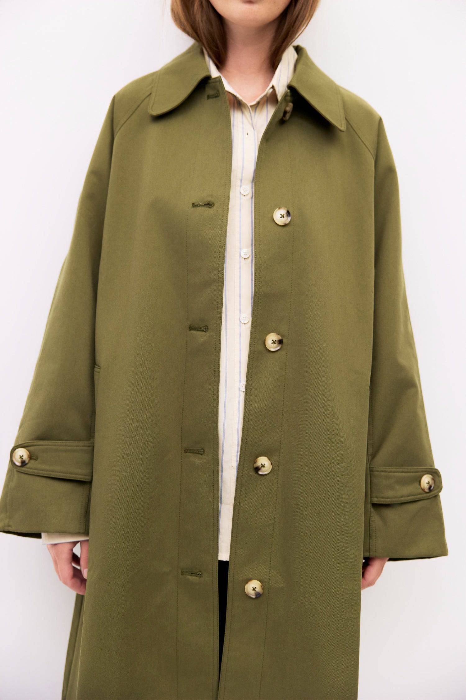 9045717582045, The Serena Coat, Outerwear, Mod Ref, beige,cf-color-beige,cf-color-olive,cf-size-l,cf-size-m,cf-size-s,cf-vendor-mod-ref,Coat,coat jacket,Comfort,Comfortable,Detail,Details,Fall,layer,layering,Layers,Long,Long Sleeve,midi length,modref,new,Olive,Outerwear,Oversized,Oversized Coat,Peacoat,Pockets,scarf,Spring,Summer,Transitional,Trench,Trench Coat,Womens, Information The Serena Coat blends timeless tailoring with contemporary ease, featuring a pointed collar and raglan sleeves for a relaxed ye