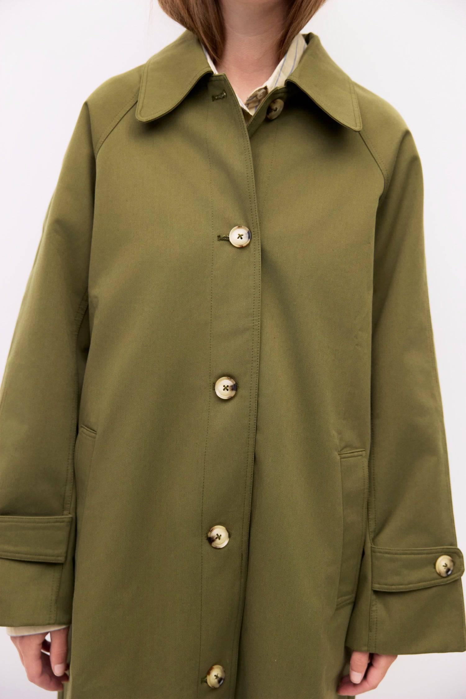 9045717582045, The Serena Coat, Outerwear, Mod Ref, beige,cf-color-beige,cf-color-olive,cf-size-l,cf-size-m,cf-size-s,cf-vendor-mod-ref,Coat,coat jacket,Comfort,Comfortable,Detail,Details,Fall,layer,layering,Layers,Long,Long Sleeve,midi length,modref,new,Olive,Outerwear,Oversized,Oversized Coat,Peacoat,Pockets,scarf,Spring,Summer,Transitional,Trench,Trench Coat,Womens, Information The Serena Coat blends timeless tailoring with contemporary ease, featuring a pointed collar and raglan sleeves for a relaxed ye