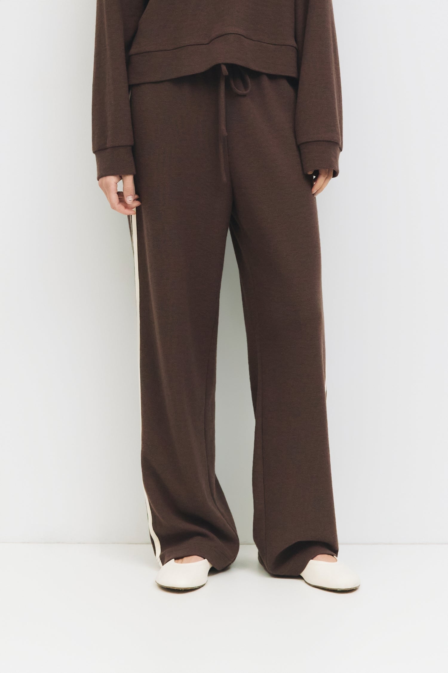 9084508078301, The Enzo Pants, Bottoms, All Row, Basic,Basics,Bottoms,brown,Casual,cf-color-brown,cf-color-navy,cf-size-l,cf-size-m,cf-size-s,cf-vendor-mod-ref,Chestnut Brown,Comfortable,dark brown,Drawstring,drawstring waist,Everyday,Long Pants,Lounge,Loungewear,mid rise,modref,Navy,Pants,Patch Pockets,Relaxed,Relaxed Fit,Sets,Spring,waffle knit,Wide Leg,Wide Leg Pants,women,Womens, Information The Enzo Pants blend sporty style with relaxed comfort, featuring a wide-leg fit and elastic drawstring waistband