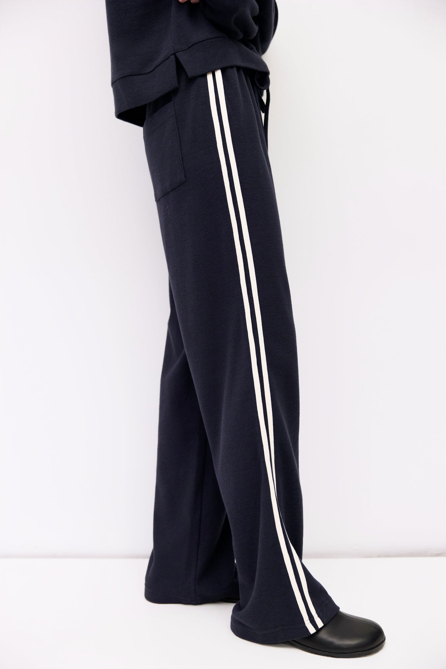 9084508078301, The Enzo Pants, Bottoms, All Row, Basic,Basics,Bottoms,brown,Casual,cf-color-brown,cf-color-navy,cf-size-l,cf-size-m,cf-size-s,cf-vendor-mod-ref,Chestnut Brown,Comfortable,dark brown,Drawstring,drawstring waist,Everyday,Long Pants,Lounge,Loungewear,mid rise,modref,Navy,Pants,Patch Pockets,Relaxed,Relaxed Fit,Sets,Spring,waffle knit,Wide Leg,Wide Leg Pants,women,Womens, Information The Enzo Pants blend sporty style with relaxed comfort, featuring a wide-leg fit and elastic drawstring waistband
