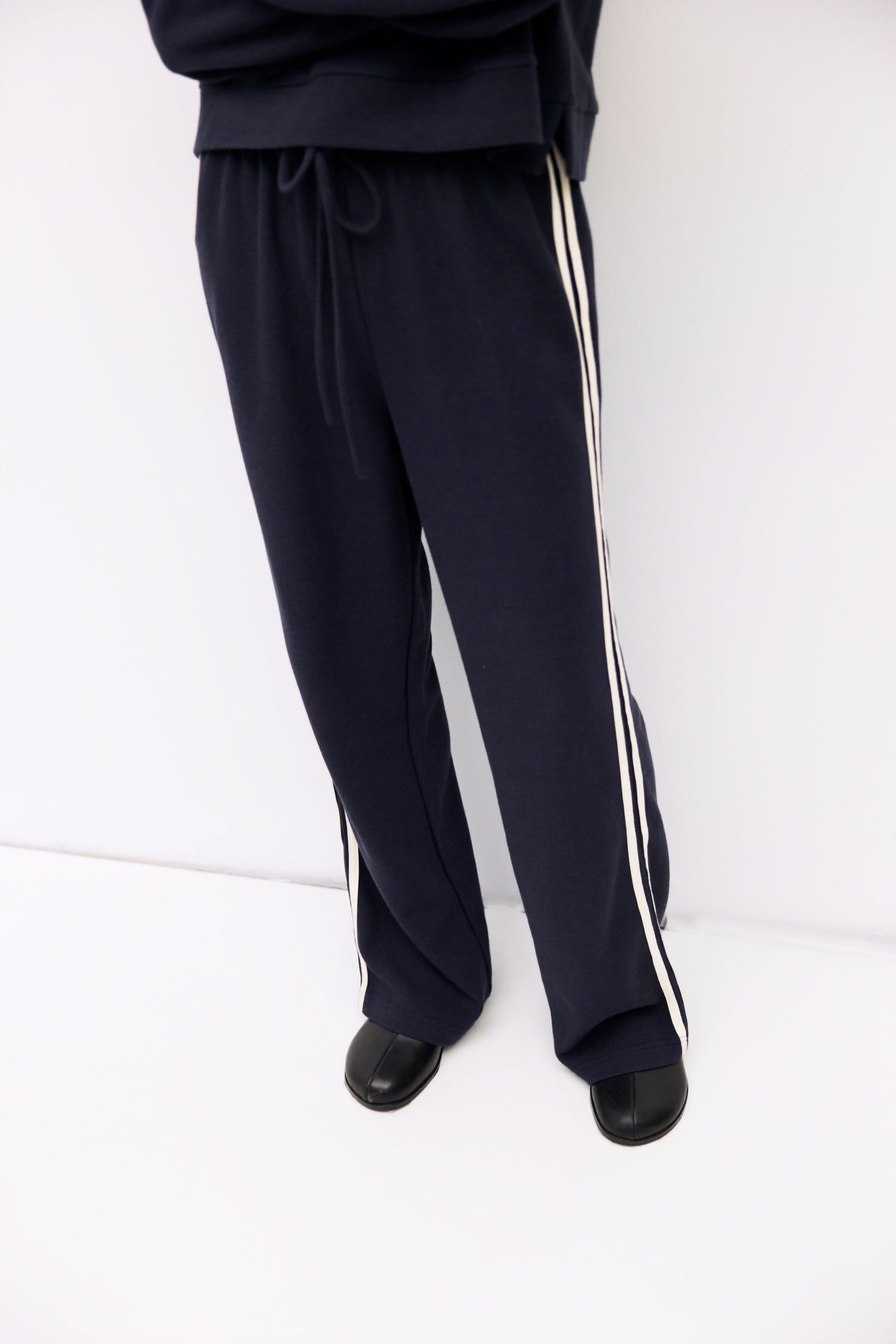 9084508078301, The Enzo Pants, Bottoms, All Row, Basic,Basics,Bottoms,brown,Casual,cf-color-brown,cf-color-navy,cf-size-l,cf-size-m,cf-size-s,cf-vendor-mod-ref,Chestnut Brown,Comfortable,dark brown,Drawstring,drawstring waist,Everyday,Long Pants,Lounge,Loungewear,mid rise,modref,Navy,Pants,Patch Pockets,Relaxed,Relaxed Fit,Sets,Spring,waffle knit,Wide Leg,Wide Leg Pants,women,Womens, Information The Enzo Pants blend sporty style with relaxed comfort, featuring a wide-leg fit and elastic drawstring waistband