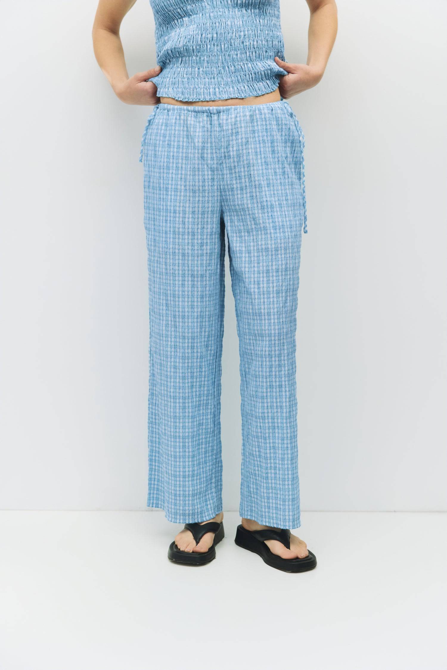 8983732879581, The Ebony Pants, Bottoms, All Row, Basic,Basics,Bottoms,Casual,cf-size-l,cf-size-m,cf-size-s,cf-vendor-mod-ref,Comfortable,Everyday,Front Pocket,Long Pants,mid rise,modref,Pants,Patch Pockets,Pleated,Pockets,Sets,Spring,straight fit,Transitional,white,women,Womens, Information The Ebony Pants are relaxed-fit, ankle-length plaid pants with an elasticized waistband and adjustable side ties for the perfect fit. Their wide-leg silhouette makes them an easy, comfortable choice for everyday wear an