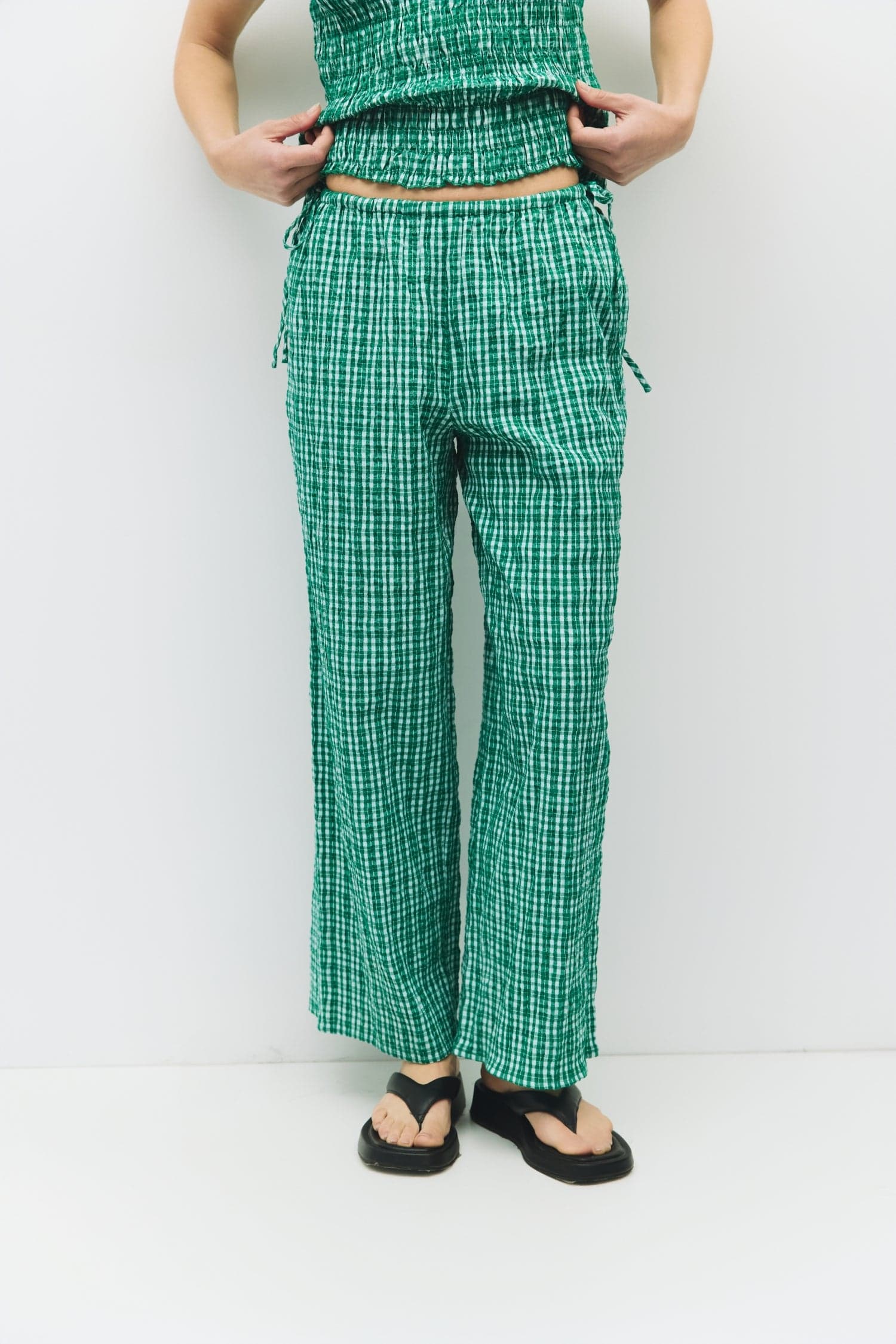 8983732879581, The Ebony Pants, Bottoms, All Row, Basic,Basics,Bottoms,Casual,cf-size-l,cf-size-m,cf-size-s,cf-vendor-mod-ref,Comfortable,Everyday,Front Pocket,Long Pants,mid rise,modref,Pants,Patch Pockets,Pleated,Pockets,Sets,Spring,straight fit,Transitional,white,women,Womens, Information The Ebony Pants are relaxed-fit, ankle-length plaid pants with an elasticized waistband and adjustable side ties for the perfect fit. Their wide-leg silhouette makes them an easy, comfortable choice for everyday wear an