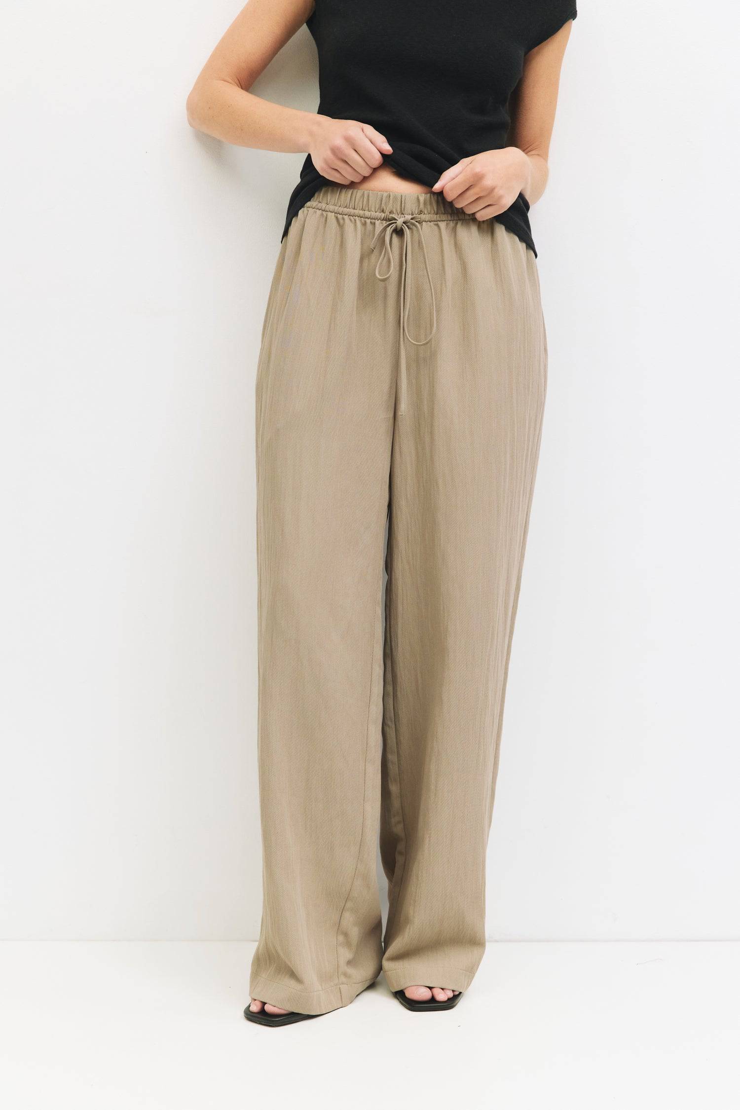 9045669282013, The Matilda Pants, Bottoms, Mod Ref, beige,Breathable,brown,Casual,cf-color-beige,cf-color-bone,cf-color-brown,cf-color-olive,cf-size-l,cf-size-m,cf-size-s,cf-vendor-mod-ref,Cotton,Elastic,Elastic Waistband,everyday,Front Tie,front ties,ivory,Lightweight,Long Pants,new,nylon,Pants,Pocket,Pockets,Relaxed,Relaxed Fit,Semi-Casual,side pockets,Tie,wide,Wide Leg,Wide Leg Pants,womens, Information The Matilda Pants are wide-leg pull-on pants designed with an adjustable elastic waistband and feature