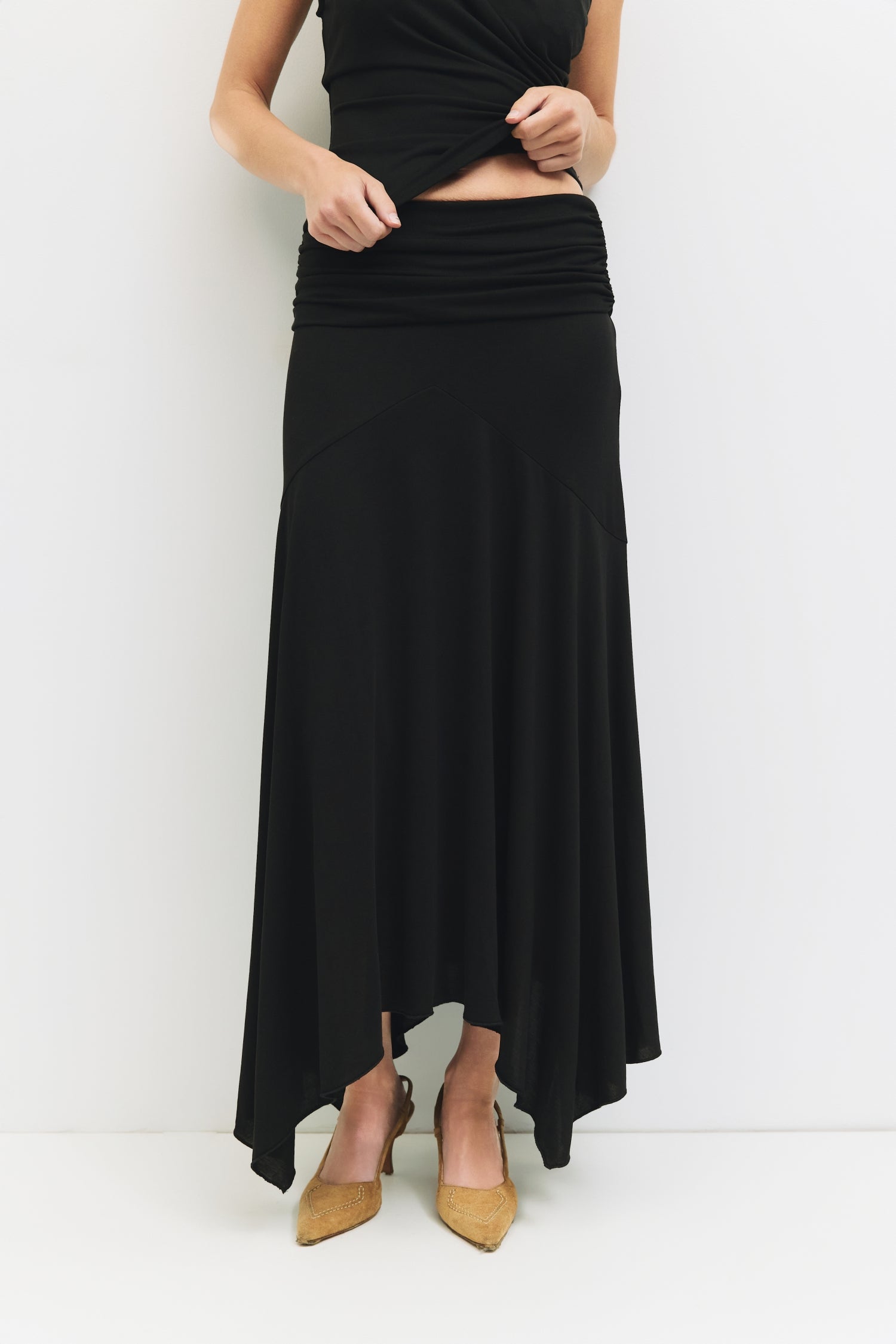 9065329950941, The Oceane Skirt, Bottoms, All Row, Black,Bottom,Bottoms,Breathable,cf-color-black,cf-color-white,cf-size-l,cf-size-m,cf-size-s,cf-vendor-all-row,Comfortable,dressy,Elastic,Elastic Waist,Elastic Waistband,Elegant,everyday,High Waist,matching,Matching Set,Maxi,maxi skirt,new,ruched,Semi-Formal,Skirt,spring,Summer,versatile,womens, Information The Oceane Skirt is designed with a softly draped handkerchief hem for effortless movement. The ruched elastic waist creates a flattering, sculpted shape