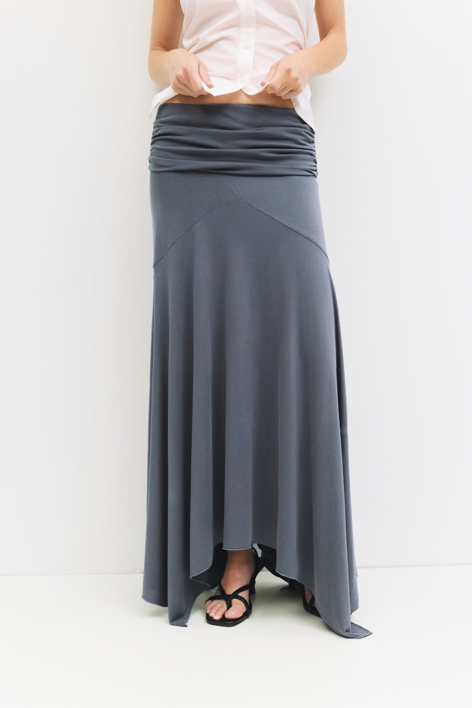 9065329950941, The Oceane Skirt, Bottoms, All Row, Black,Bottom,Bottoms,Breathable,cf-color-black,cf-color-white,cf-size-l,cf-size-m,cf-size-s,cf-vendor-all-row,Comfortable,dressy,Elastic,Elastic Waist,Elastic Waistband,Elegant,everyday,High Waist,matching,Matching Set,Maxi,maxi skirt,new,ruched,Semi-Formal,Skirt,spring,Summer,versatile,womens, Information The Oceane Skirt is designed with a softly draped handkerchief hem for effortless movement. The ruched elastic waist creates a flattering, sculpted shape