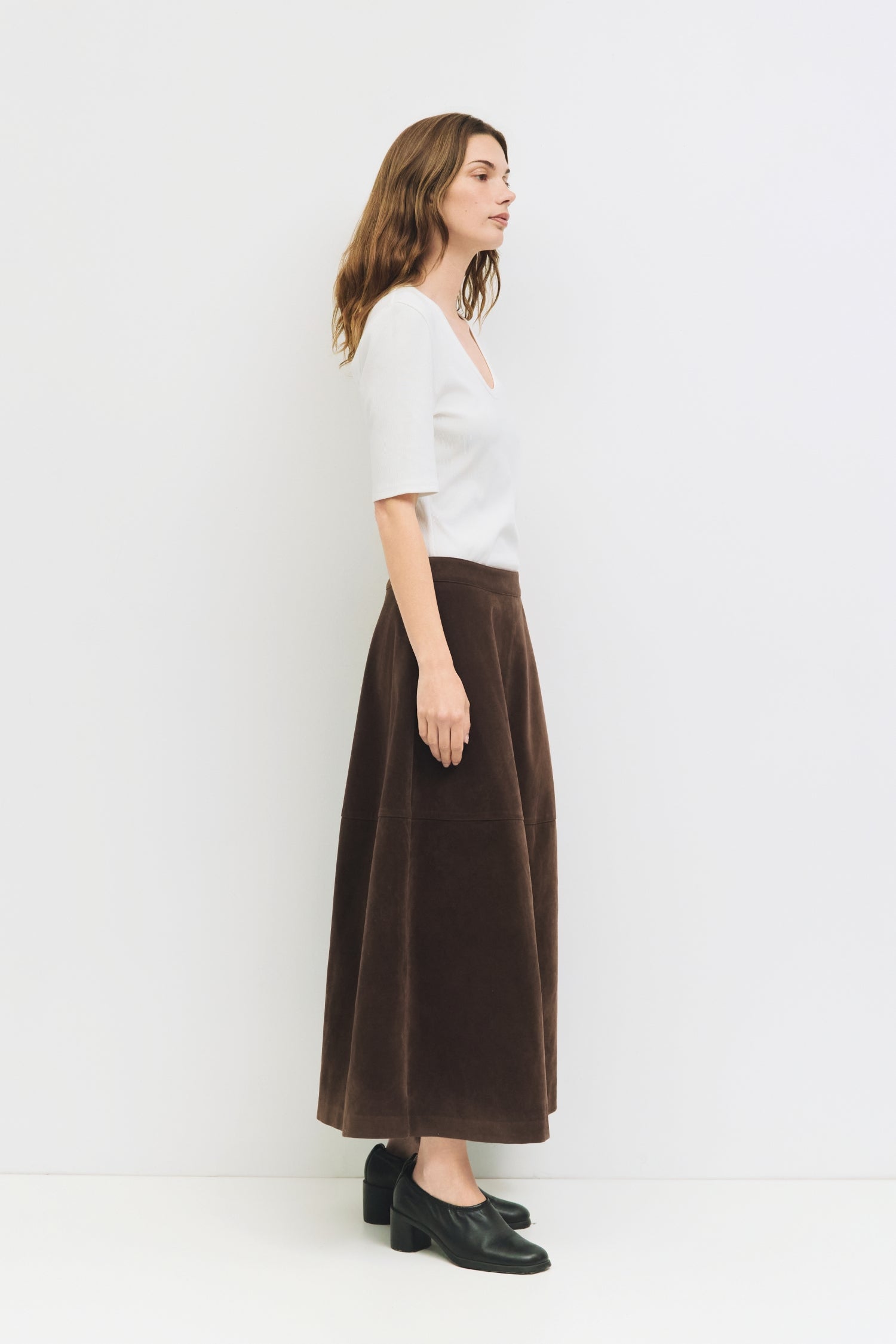 9084503818461, The Eryn Skirt, Bottoms, All Row, Bottom,Bottoms,brown,cf-color-brown,cf-color-khaki,cf-size-l,cf-size-m,cf-size-s,cf-vendor-all-row,Chestnut Brown,Comfortable,dark brown,everyday,Fall,Khaki,Matching Set,mid rise,mid waist,mid weight,Midi Skirt,new,Semi-Formal,set,Sets,Skirt,spring,Structured,suede,Textured Fabric,versatile,womens, Information The Eryn Skirt is a sleek A-line midi crafted from midweight suede, designed with a side invisible zipper and hidden hook-and-eye closure for a clean f