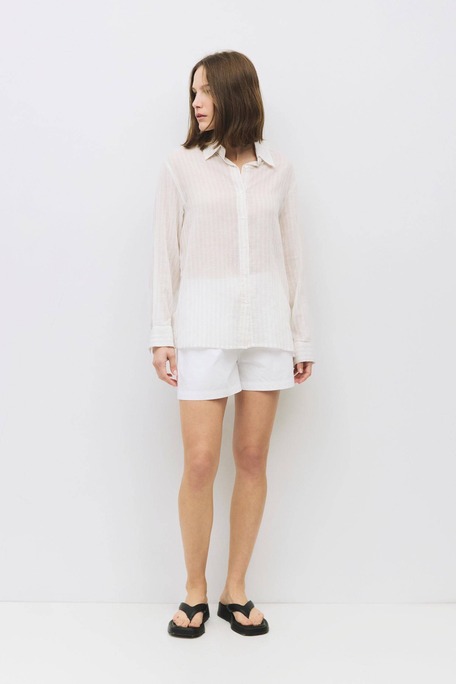 8983744217309, The Frazier Top, Tops, All Row, Black,Breathable,Button down,Button Down Shirt,Button Up,Casual,cf-color-black,cf-color-blue,cf-color-white,cf-size-l,cf-size-m,cf-size-s,cf-vendor-mod-ref,cinched,Cinched Back,Cinched Waist,collared,Collared Top,Cotton,everyday,Long Sleeve,Long Sleeve Top,new,Oversized,spring,Striped,Summer,Tops,Transitional,white,womens,Work,Workwear, Information The Frazier Top is a lightweight, button-down shirt with a boyfriend fit and a classic collar neckline. Its semi-s