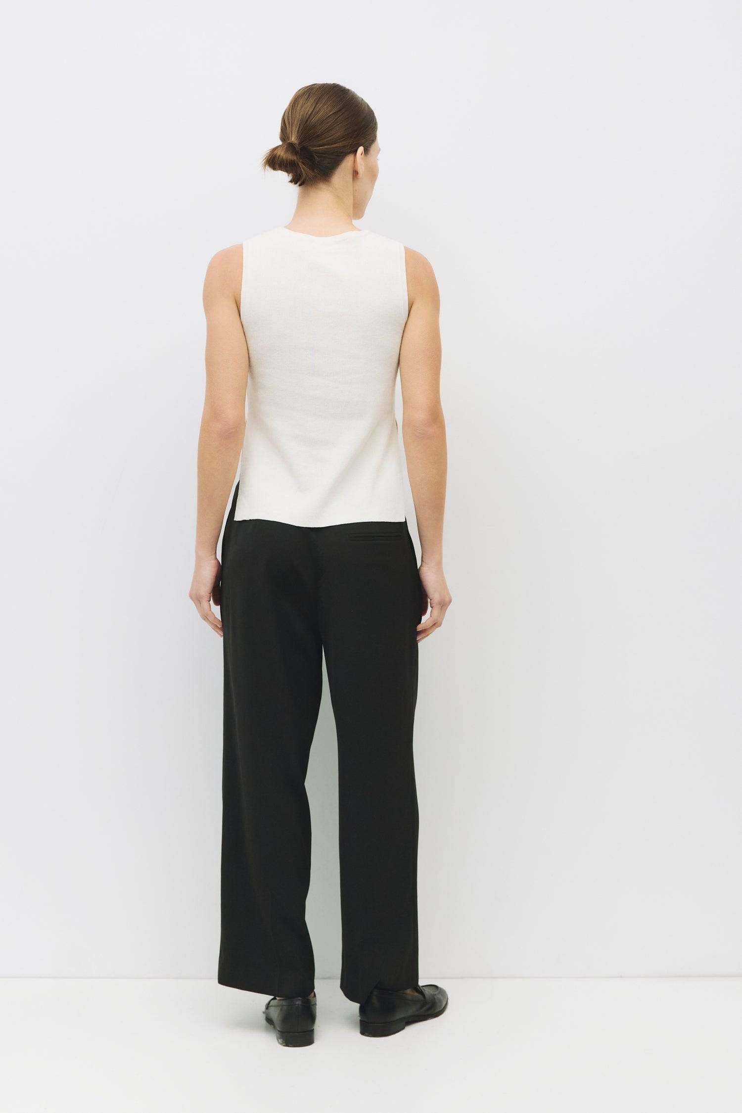 8983738777821, The Amina Top, Tops, Mod Ref, 90s,Basic,Basics,Black,Blue,Casual,cf-color-black,cf-color-blue,cf-color-white,cf-size-l,cf-size-m,cf-size-s,cf-vendor-mod-ref,Comfortable,Crew Neck,Crew Neckline,Everyday,Form Fitting,Ribbed,Ribbed Fabric,Ribbed Top,Short Sleeve,Spring,stretch,Stretchy,Summer,Tee,Tops,Transitional,white,Women's, Information The Amina Top is a sleek, sleeveless knit tank with a fitted silhouette and subtle side slits for ease of movement. Finished with a ribbed neckband and armho