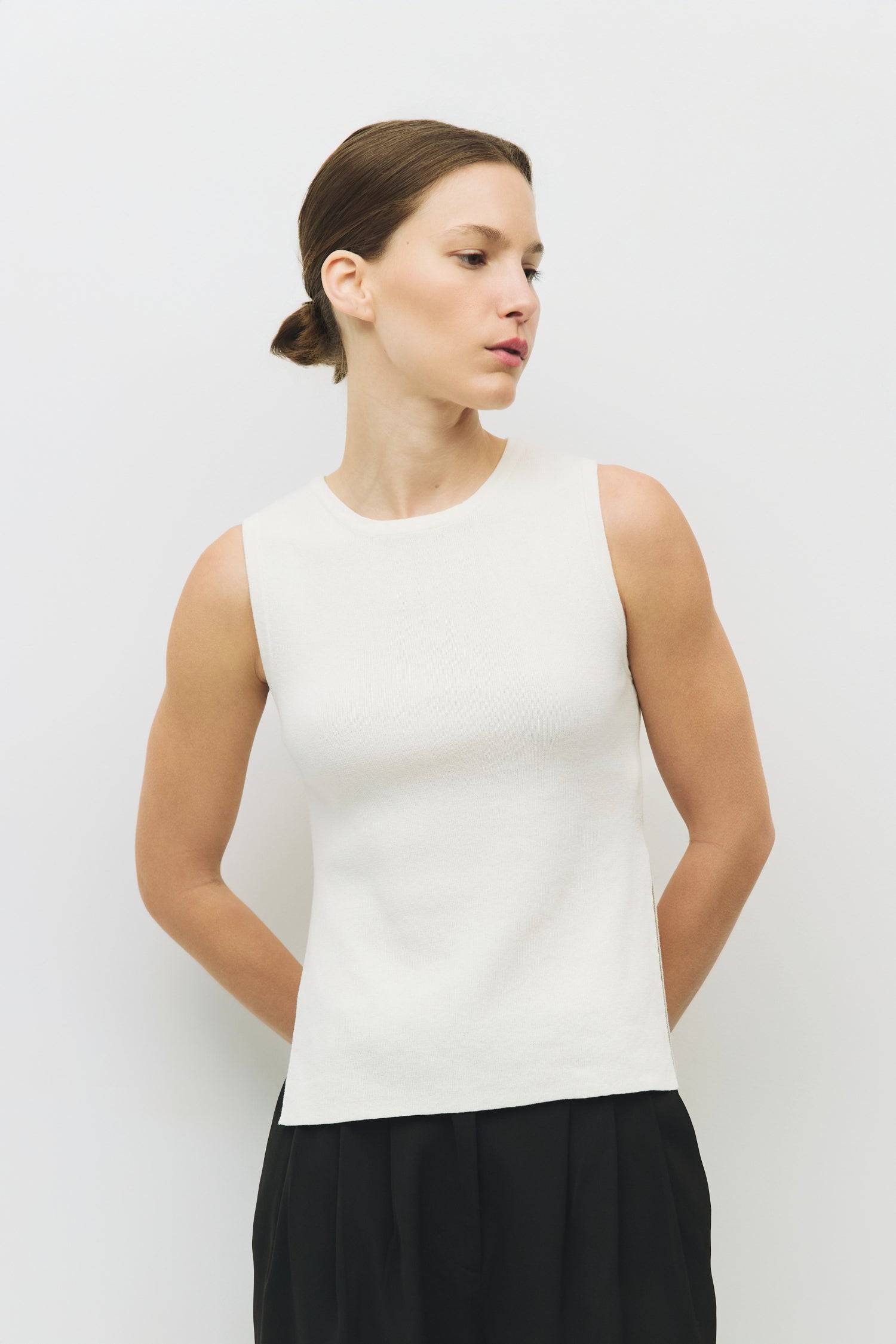 8983738777821, The Amina Top, Tops, Mod Ref, 90s,Basic,Basics,Black,Blue,Casual,cf-color-black,cf-color-blue,cf-color-white,cf-size-l,cf-size-m,cf-size-s,cf-vendor-mod-ref,Comfortable,Crew Neck,Crew Neckline,Everyday,Form Fitting,Ribbed,Ribbed Fabric,Ribbed Top,Short Sleeve,Spring,stretch,Stretchy,Summer,Tee,Tops,Transitional,white,Women's, Information The Amina Top is a sleek, sleeveless knit tank with a fitted silhouette and subtle side slits for ease of movement. Finished with a ribbed neckband and armho