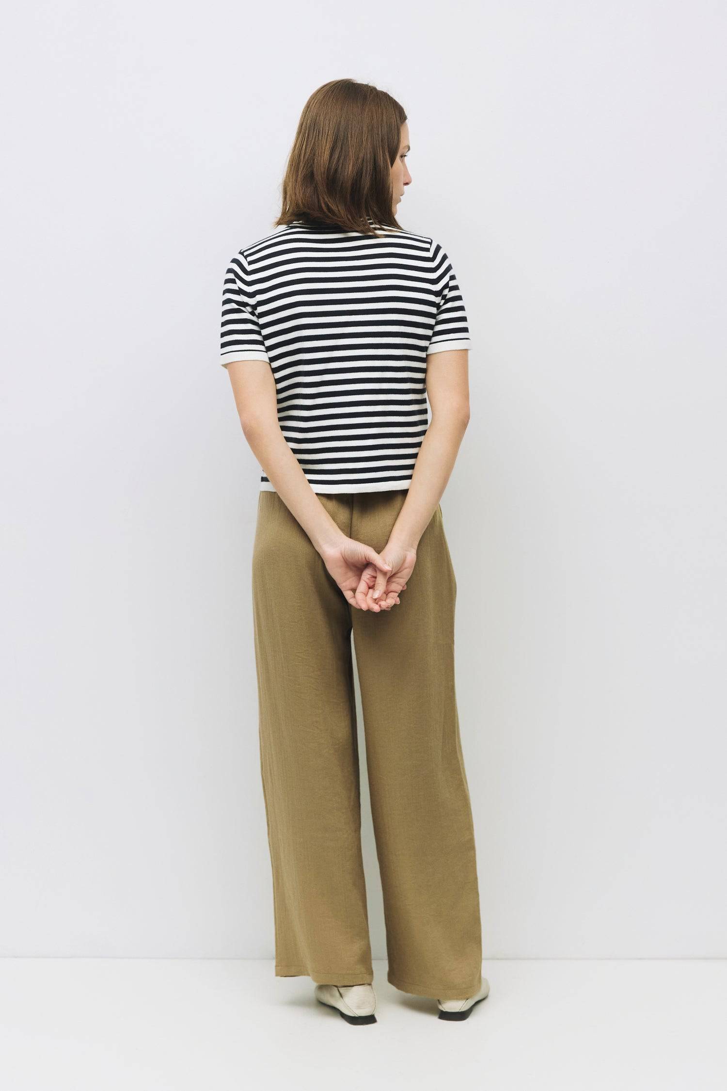 9045577728221, The Clarissa Top, Tops, Mod Ref, Basic,Basics,Black,Casual,cf-color-black,cf-size-l,cf-size-m,cf-size-s,cf-vendor-mod-ref,Comfortable,Crew Neck,Crew Neckline,Everyday,Knit,Knit Top,mid weight,Mock neck,new,Short Sleeve,Spring,Striped,Stripes,Summer,Tee,Tops,Transitional,Vertical Stripes,white,Women's,womens top, Information The Clarissa Top is a striped knit with a sleek mock neck and short sleeves, offering a timeless, structured look. Made from midweight knit, it’s finished with ribbed band