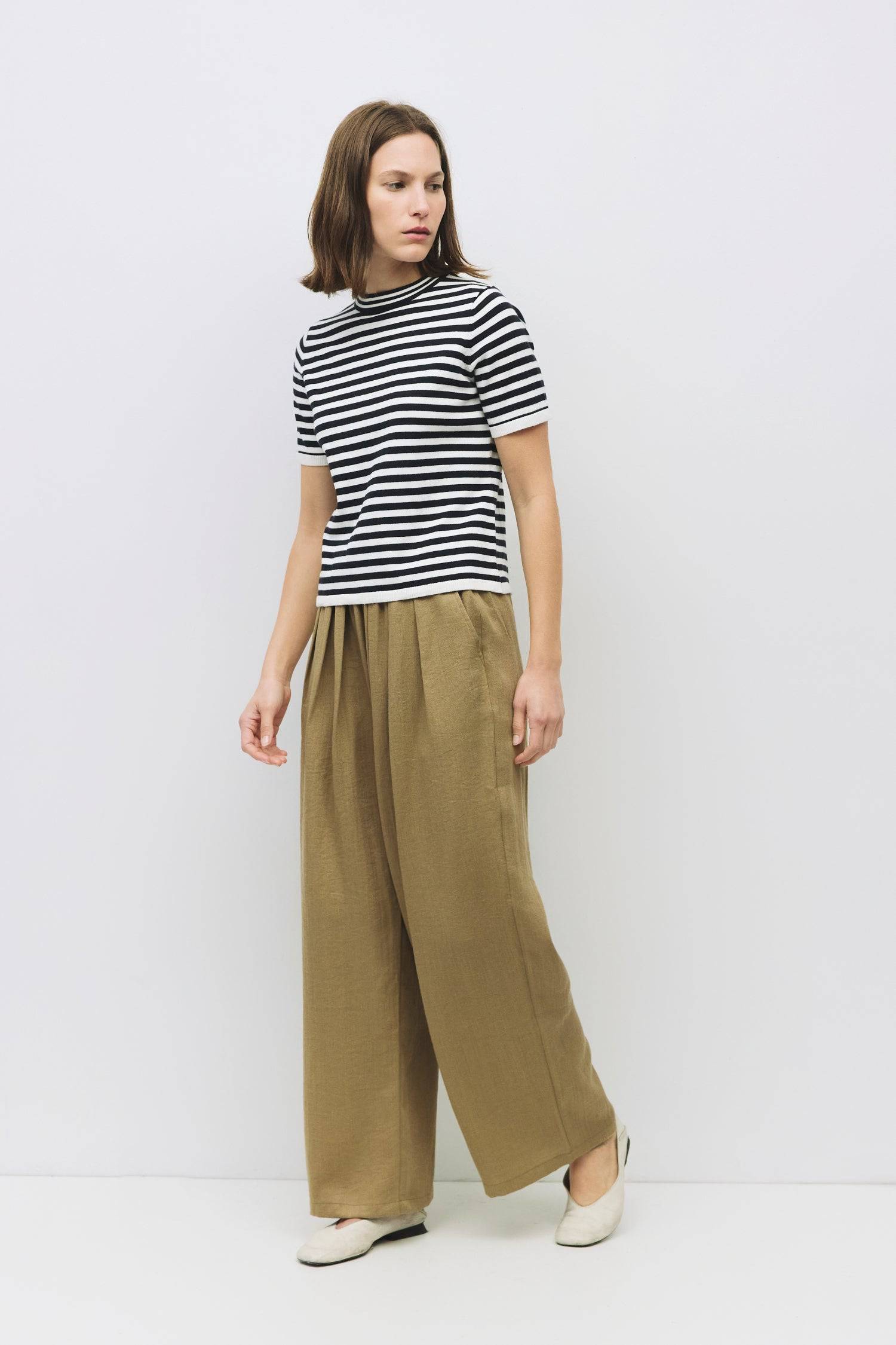 9045577728221, The Clarissa Top, Tops, Mod Ref, Basic,Basics,Black,Casual,cf-color-black,cf-size-l,cf-size-m,cf-size-s,cf-vendor-mod-ref,Comfortable,Crew Neck,Crew Neckline,Everyday,Knit,Knit Top,mid weight,Mock neck,new,Short Sleeve,Spring,Striped,Stripes,Summer,Tee,Tops,Transitional,Vertical Stripes,white,Women's,womens top, Information The Clarissa Top is a striped knit with a sleek mock neck and short sleeves, offering a timeless, structured look. Made from midweight knit, it’s finished with ribbed band