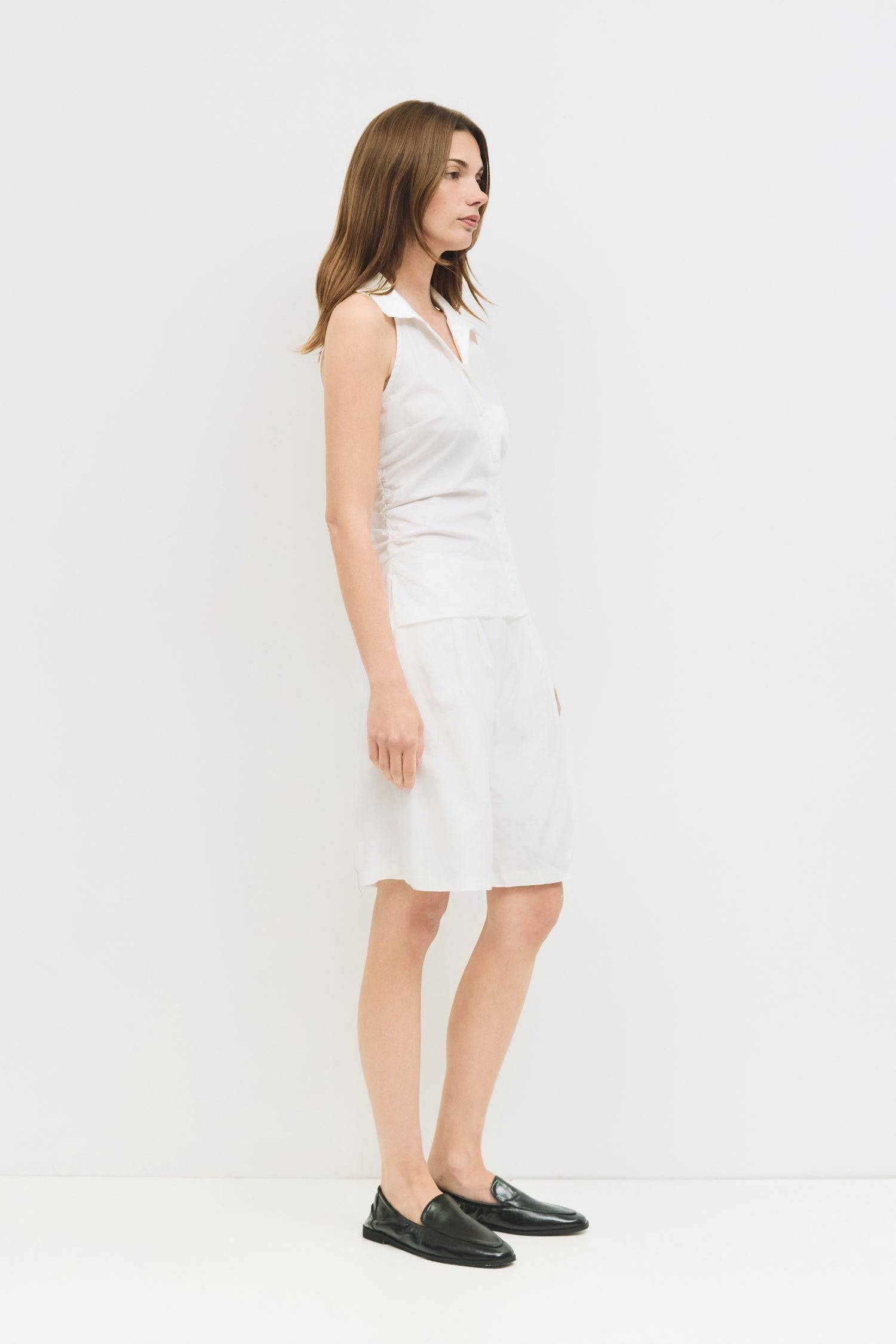 8984827855069, The Cambria Top, Tops, Mod Ref, Black,Breathable,Button down,Button Down Shirt,Button Up,Casual,cf-color-black,cf-color-blue,cf-color-white,cf-size-l,cf-size-m,cf-size-s,cf-vendor-mod-ref,cinched,Cinched Back,Cinched Waist,collared,Collared Top,Cotton,everyday,final-sale,finalsale,Long Sleeve,Long Sleeve Top,new,Oversized,sale,spring,Striped,Summer,Tops,Transitional,white,womens,Work,Workwear, Information The Cambria Top features a flattering halter neckline and a button-down front for a styl