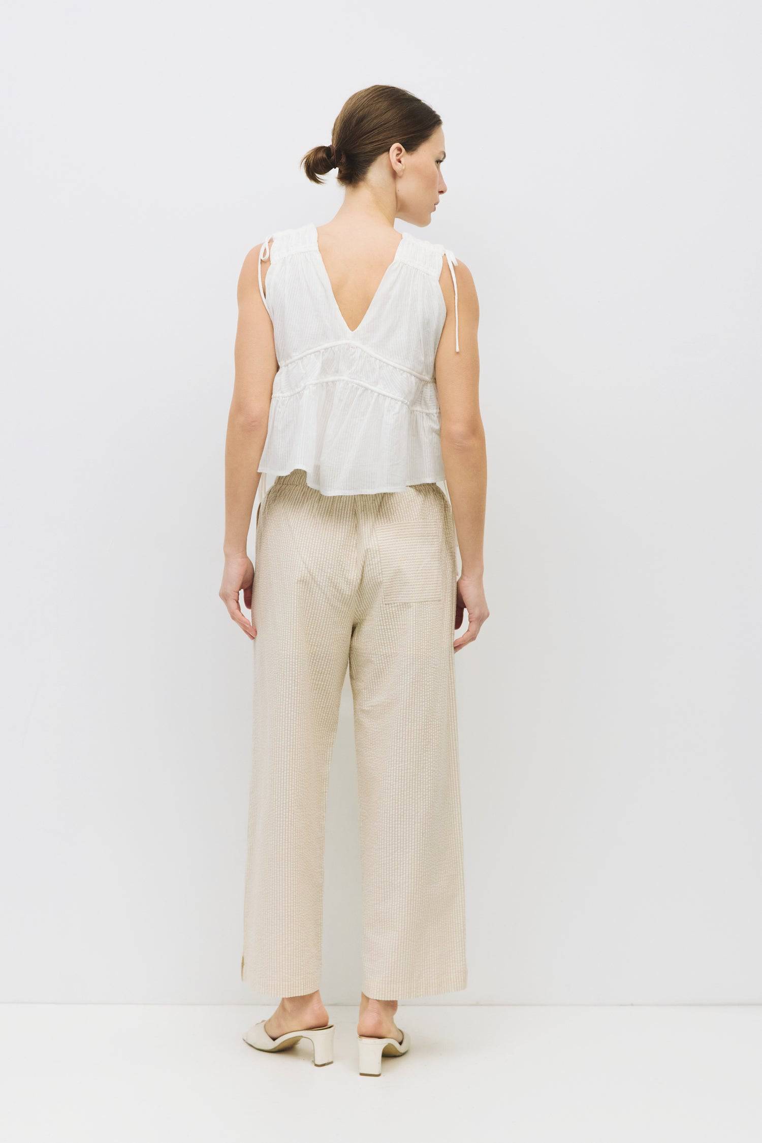 8983747625181, The Ellice Top, Tops, Mod Ref, Black,Breathable,Button down,Button Down Shirt,Button Up,Casual,cf-color-black,cf-color-blue,cf-color-white,cf-size-l,cf-size-m,cf-size-s,cf-vendor-mod-ref,cinched,Cinched Back,Cinched Waist,collared,Collared Top,Cotton,everyday,final-sale,finalsale,Long Sleeve,Long Sleeve Top,new,Oversized,sale,spring,Striped,Summer,Tops,Transitional,white,womens,Work,Workwear, Information The Ellice Top is a cropped, tiered, and sleeveless top with side adjustable ties. Featur